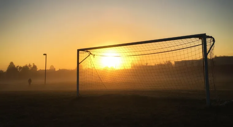 Soccer goal with sun behind